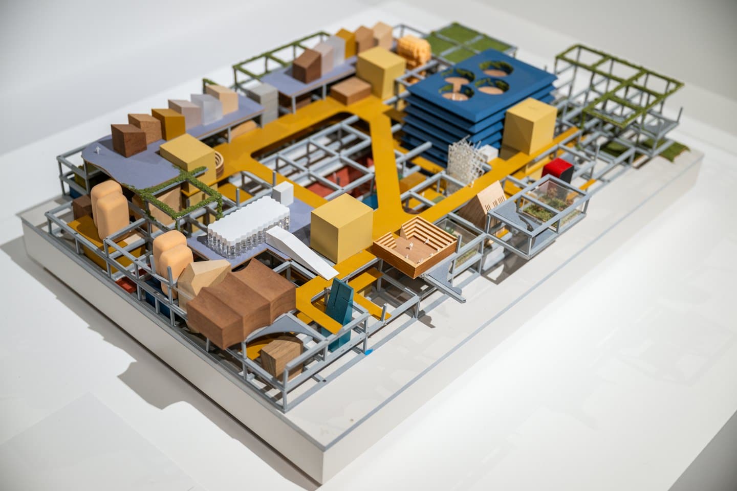 Architectural model of urban design with abstract buildings and pathways.